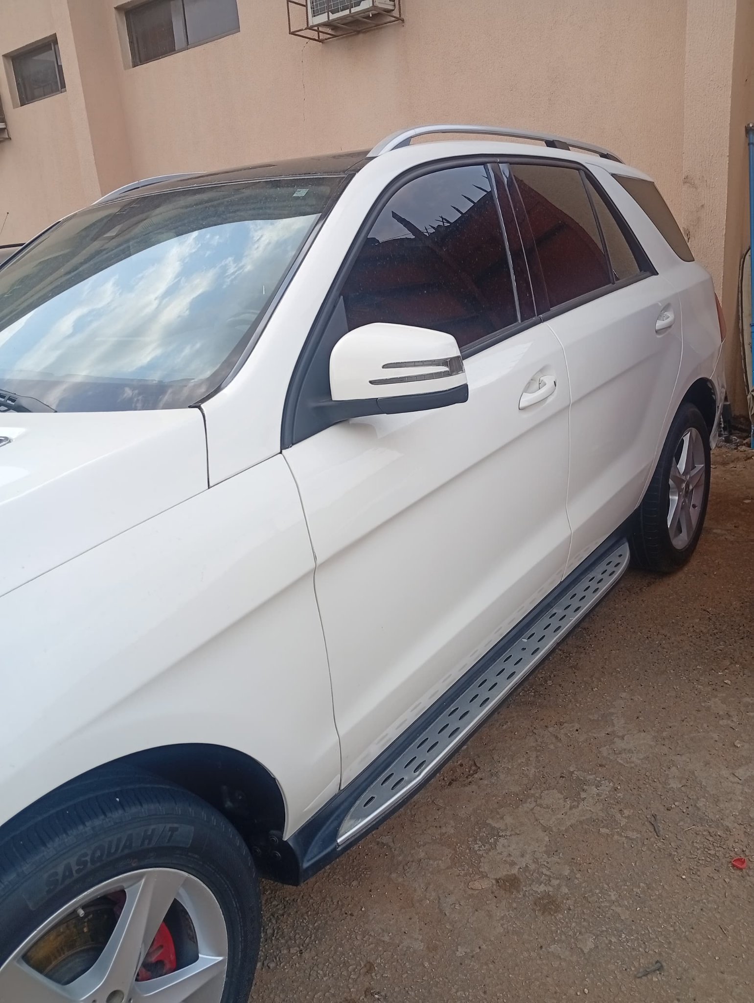 White Mercedes-Benz SUV for executive car hire in Nigeria